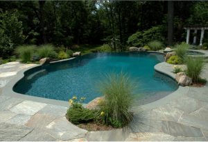 Crazy Paving Quartz with Curved Bluestone Pool Coping